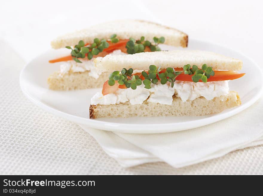 Vegetarian sandwiches with cottage cheese, tomatoes and mustard sprouts