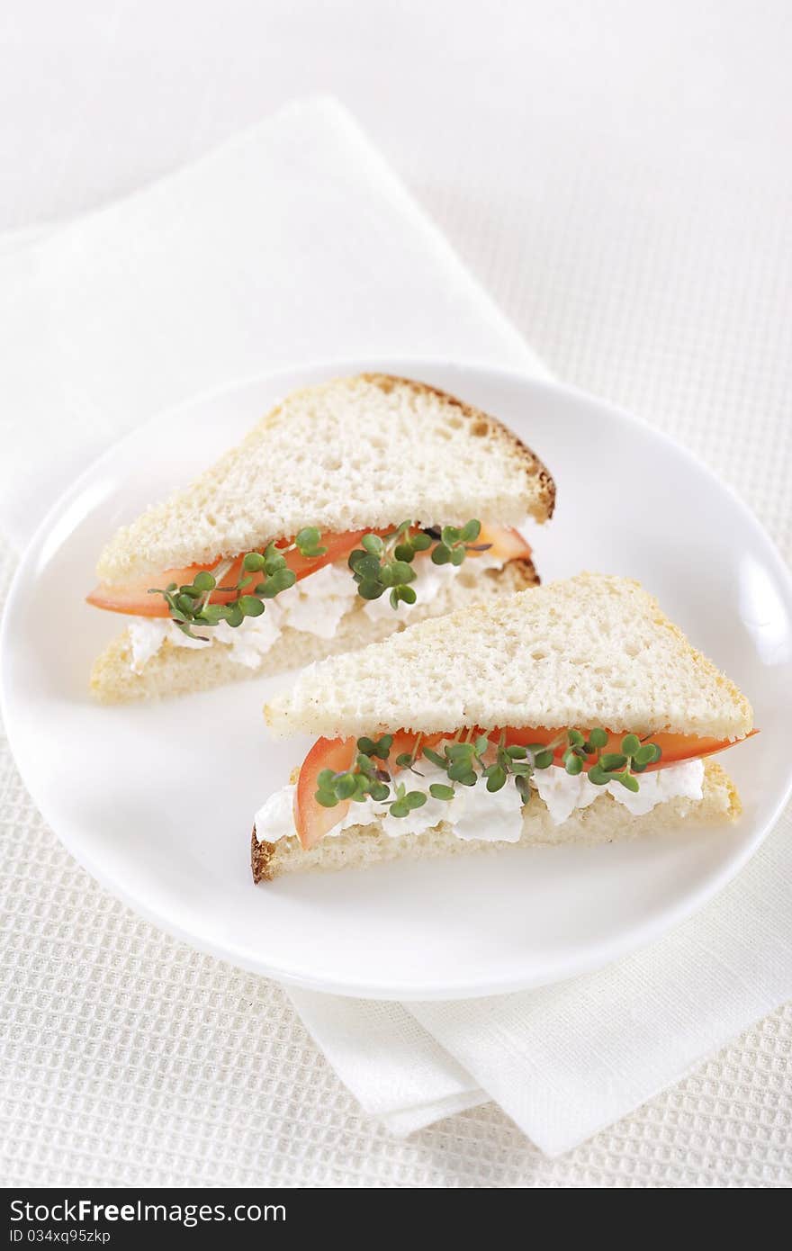 Vegetarian sandwiches with cottage cheese, tomatoes and mustard sprouts