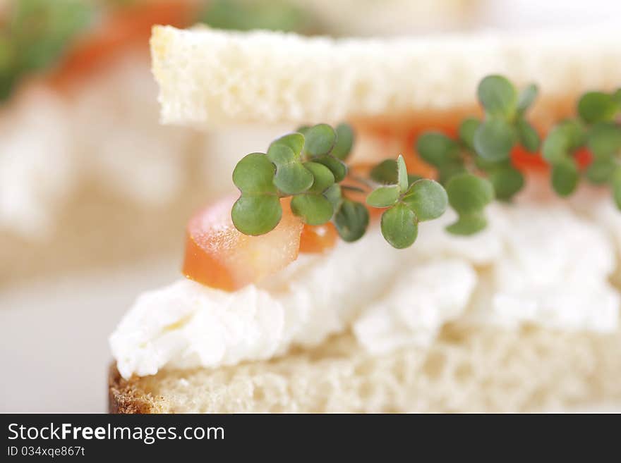 Vegetarian sandwiches with cottage cheese, tomatoes and mustard sprouts