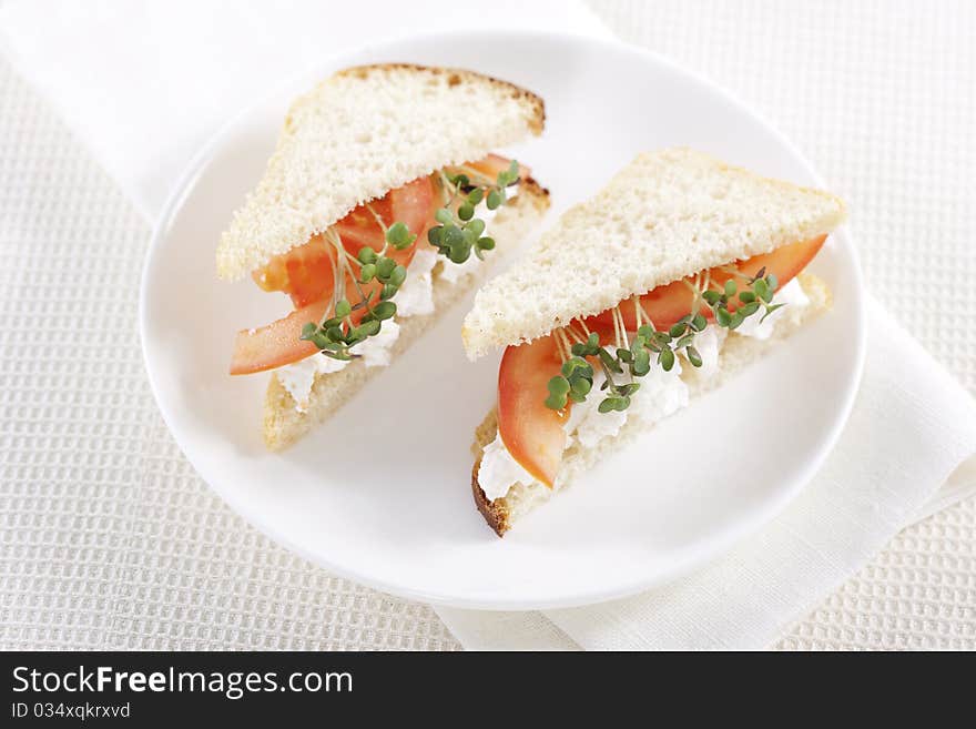 Vegetarian sandwiches with cottage cheese, tomatoes and mustard sprouts