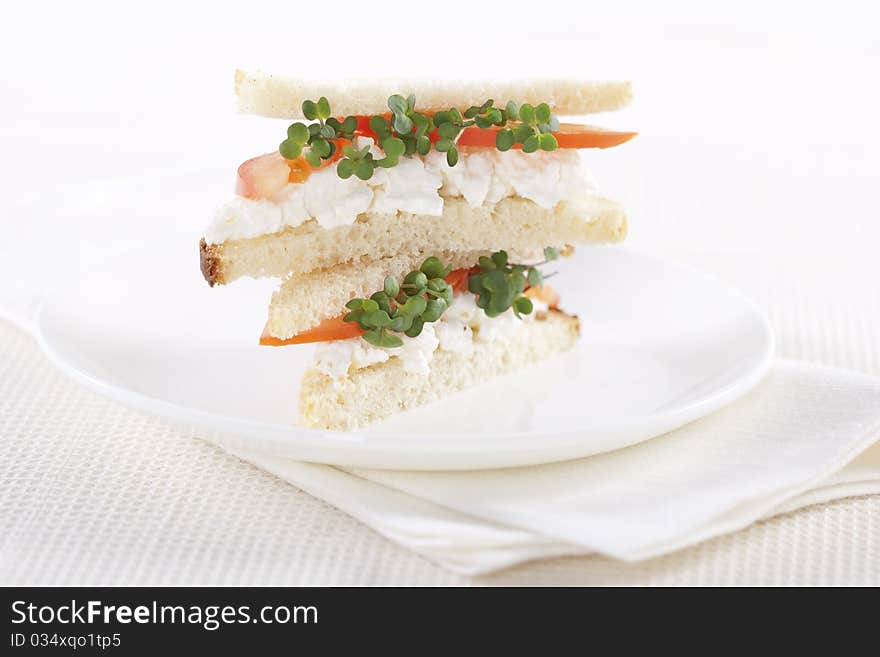 Vegetarian sandwiches with cottage cheese, tomatoes and mustard sprouts