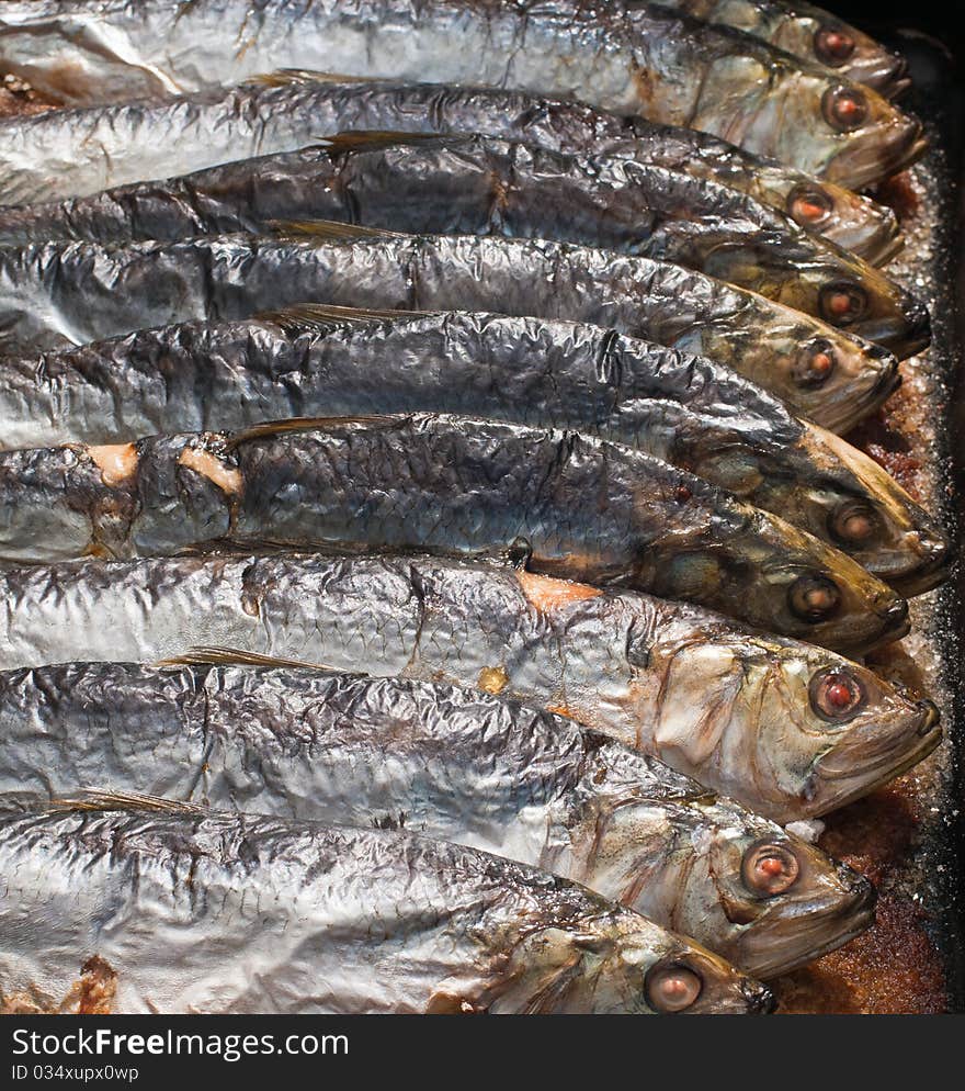 Roasted fish in baking tray .