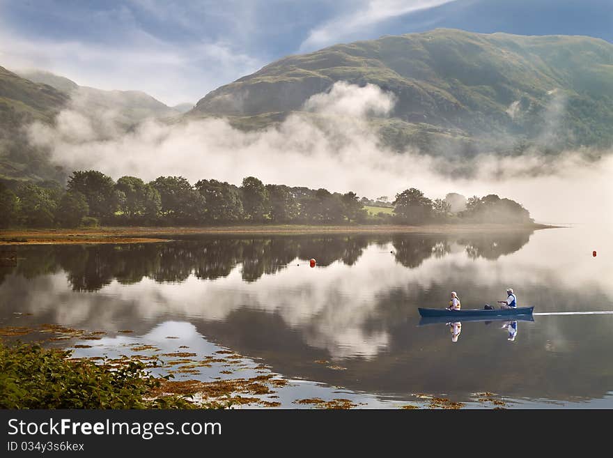 Low cloud drifts down the mountain to Loch Etive in Argyll and Bute, Scotland.