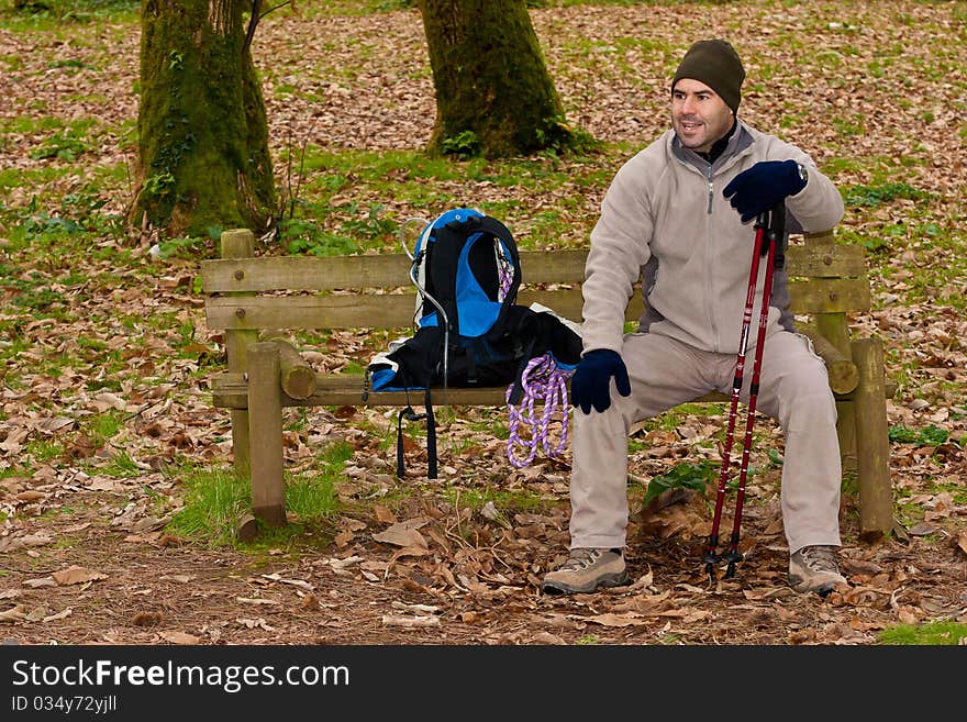 Hiker resting on bench