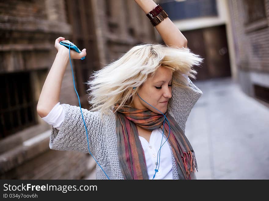 Young beautiful girl happy and dancing. Young beautiful girl happy and dancing