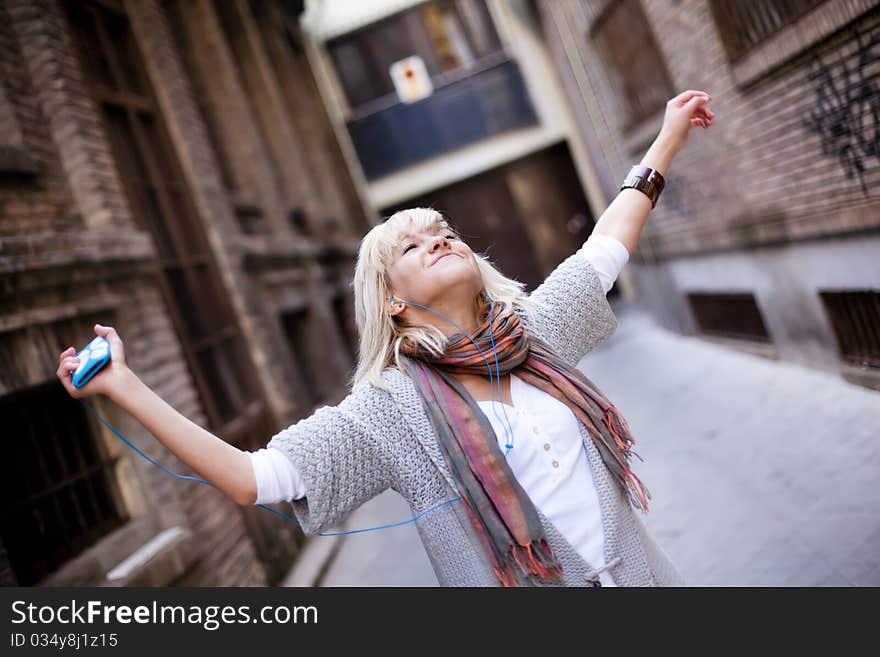 Young beautiful girl happy and dancing. Young beautiful girl happy and dancing