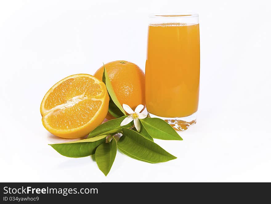 Orange anda a half with a glass of juice. Orange anda a half with a glass of juice