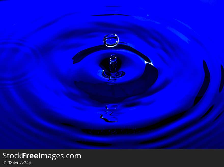 Beautiful Clear Water Drop on Blue Water. Beautiful Clear Water Drop on Blue Water