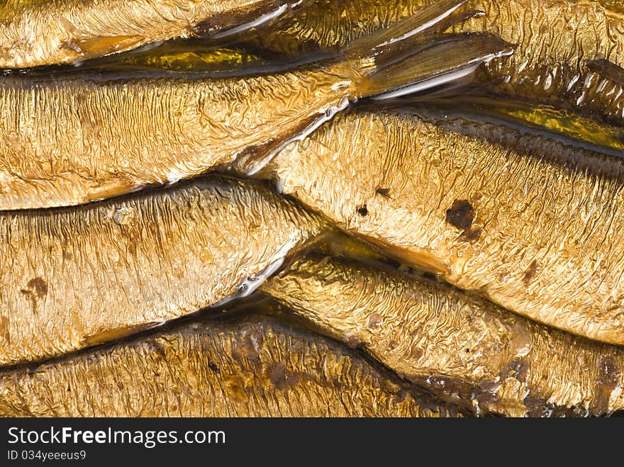 Background of the cooked sea sprats. Cooked fish. Background of the cooked sea sprats. Cooked fish