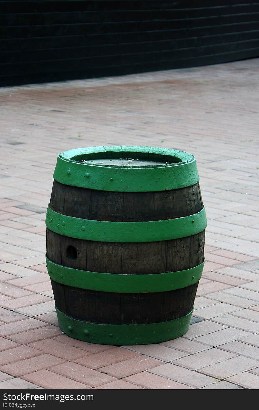 Green Wood Barrel Standing on the tiles