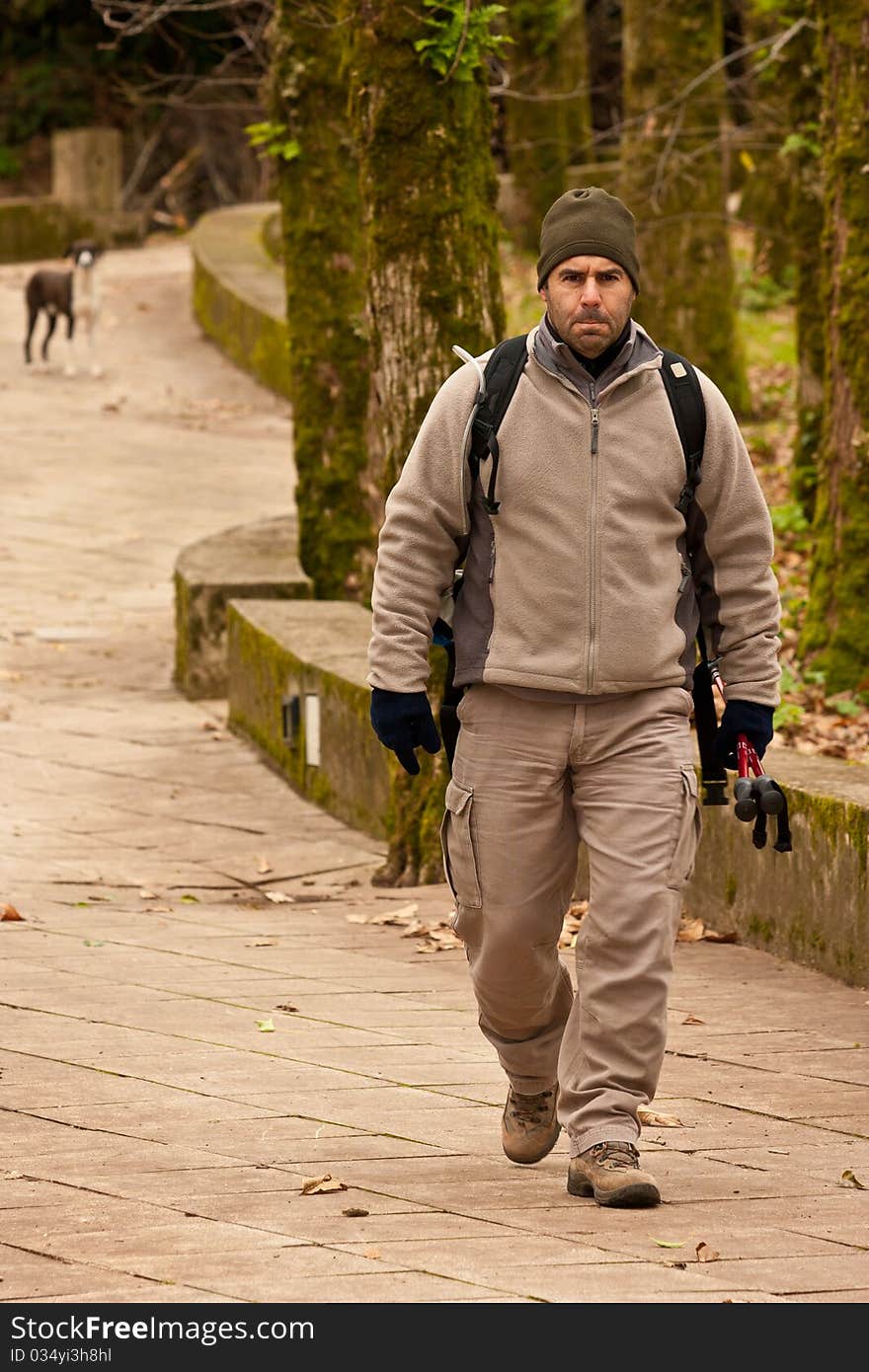 Hiker walking in a man made trail