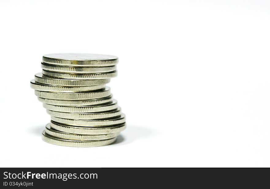 Isolated stacked coins on white background