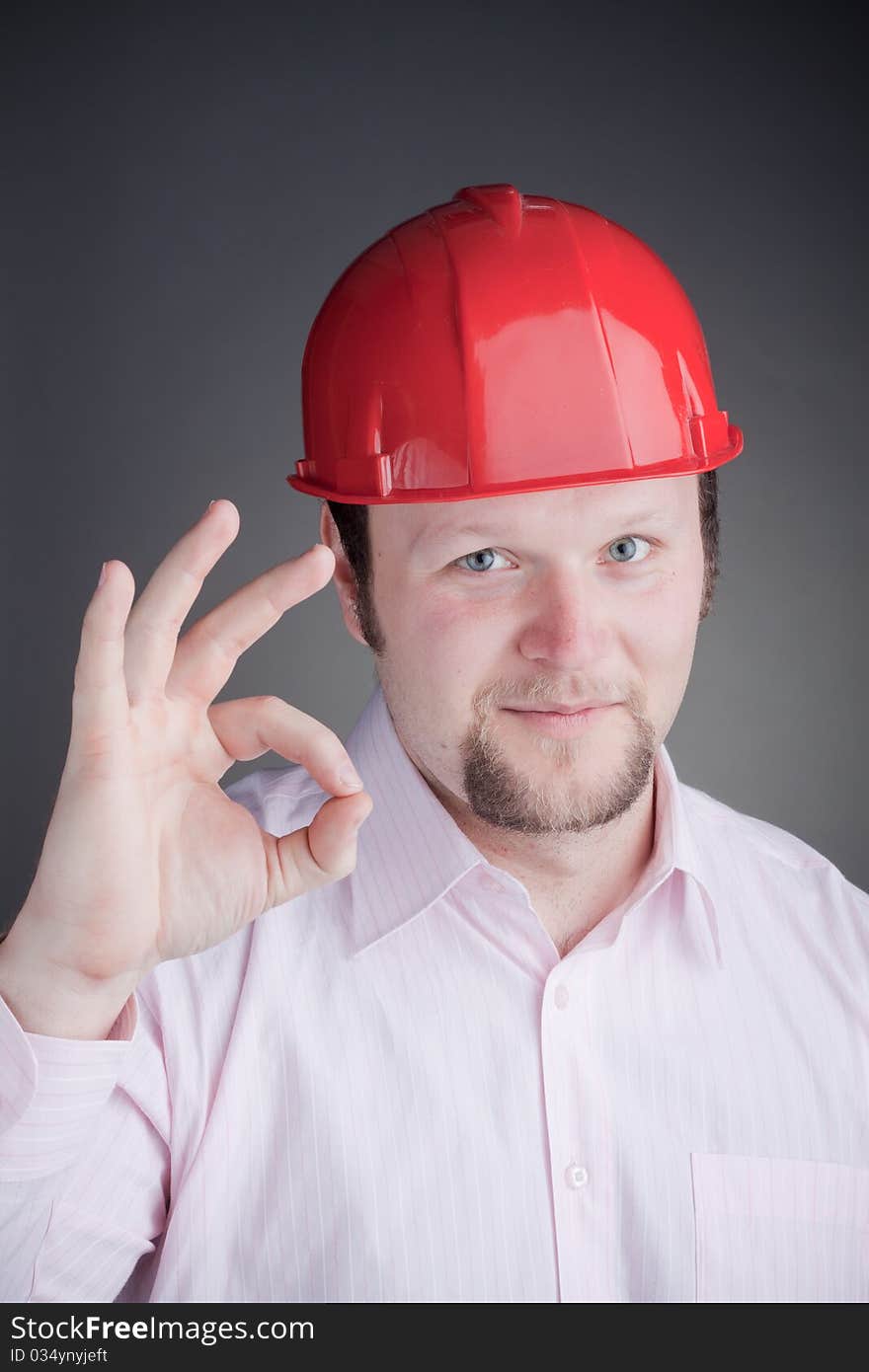 Young Engineer doing the ok sign and smiling at the camera