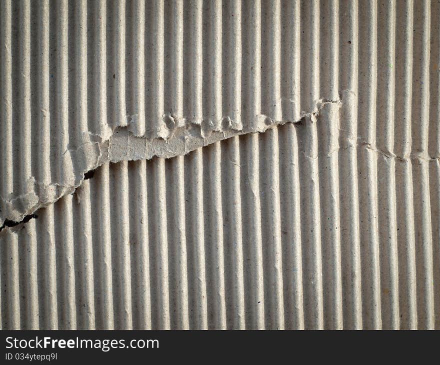 Texture of torn brown paper cardboard