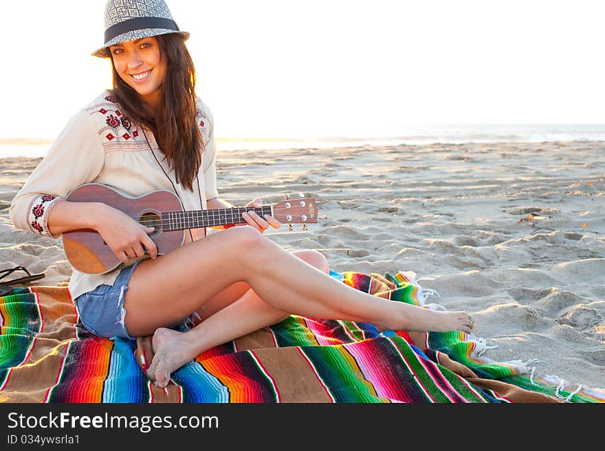 Brunette female model on beach at sunset. Brunette female model on beach at sunset