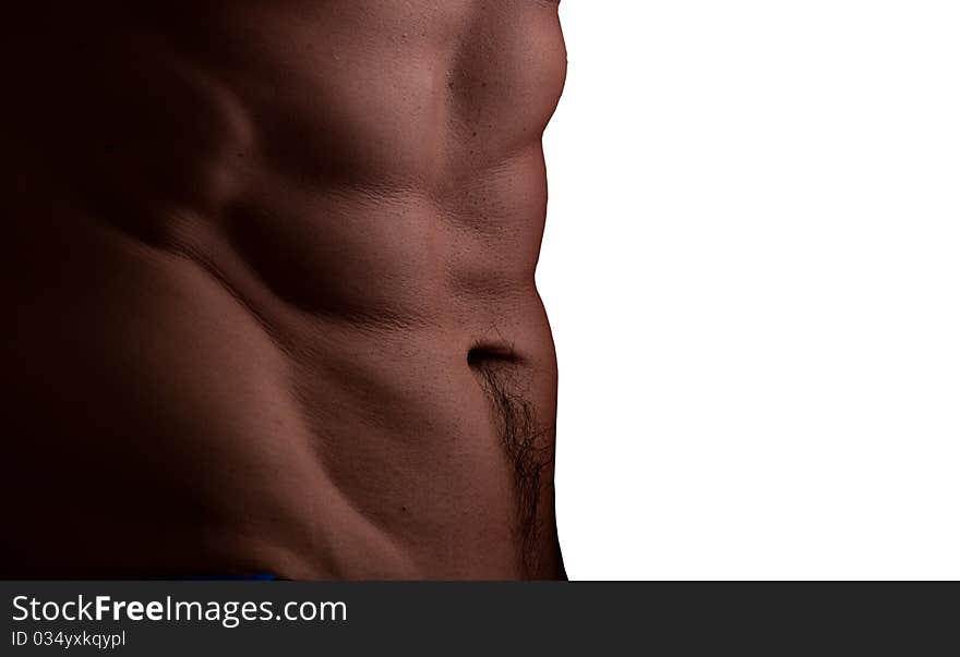 Muscular male abdomen closeup with soft light isolated on white background