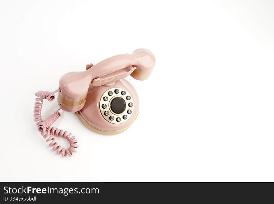 Antique pink phone isolated on white. Antique pink phone isolated on white