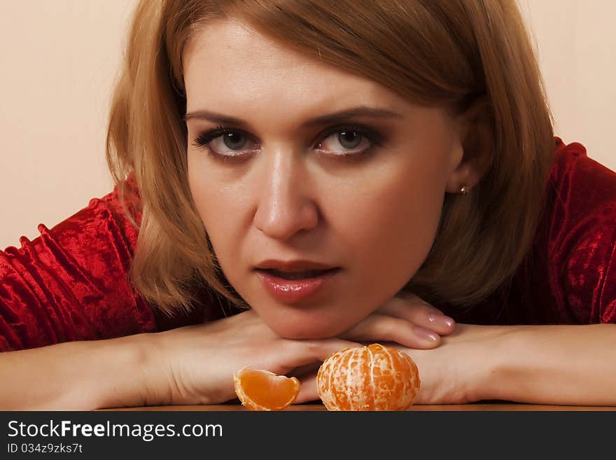 Girl with peeled mandarin