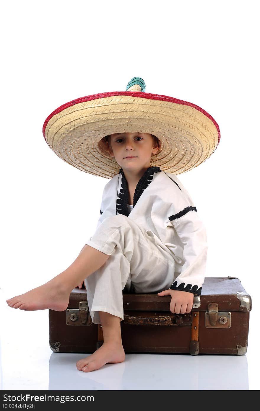 Toddler wearing a large sombrero hat. Toddler wearing a large sombrero hat