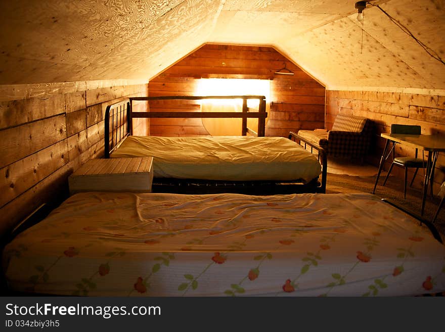 Sun streams through a remote cabin window. Sun streams through a remote cabin window