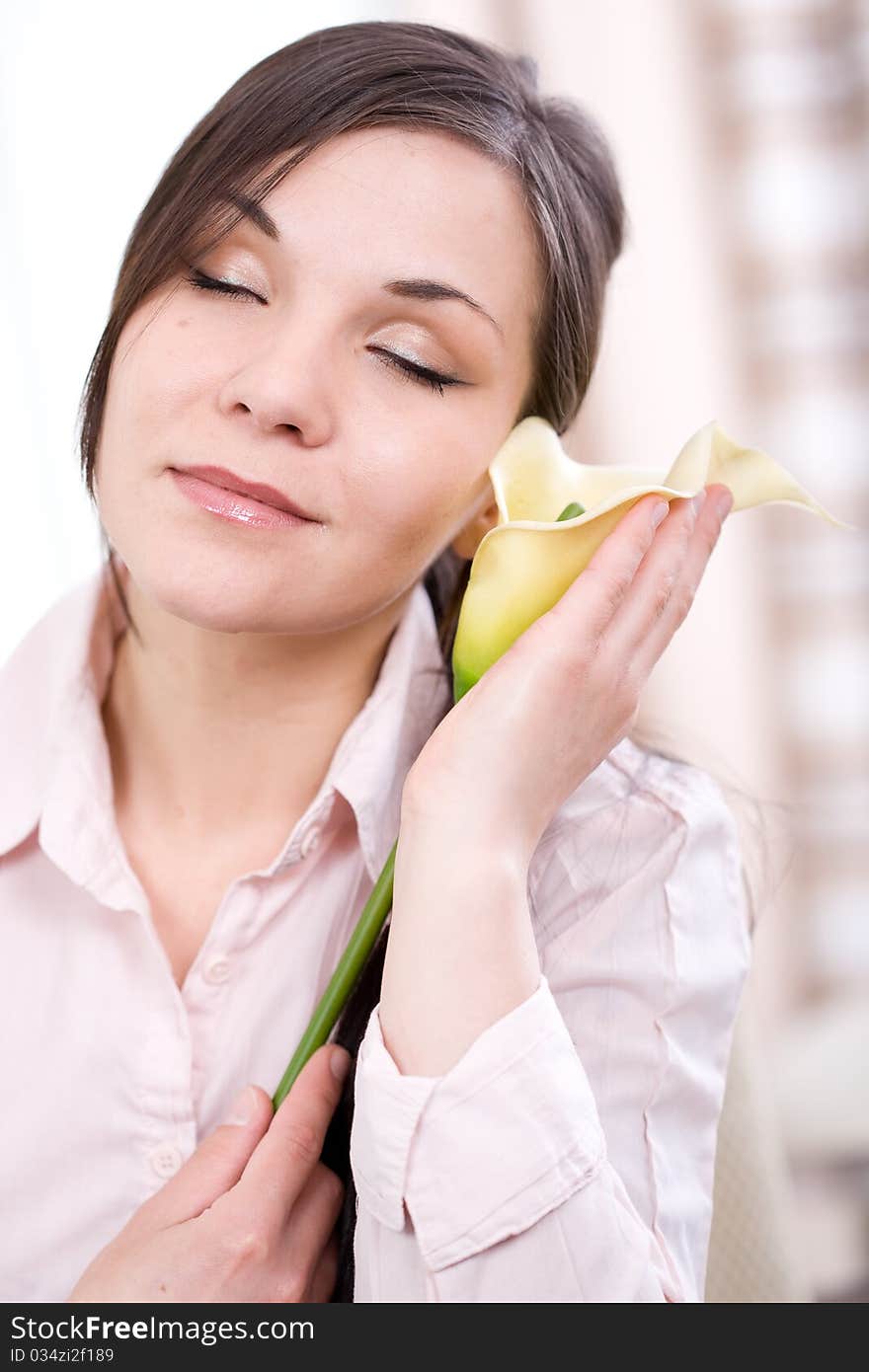 Young adult woman with flower at home. Young adult woman with flower at home