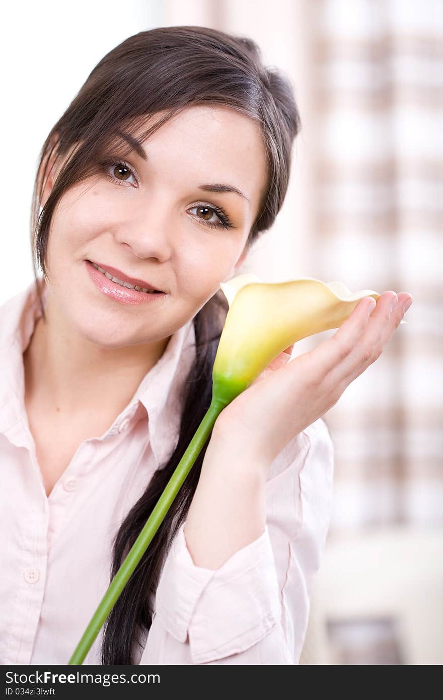 Young adult woman with flower at home. Young adult woman with flower at home