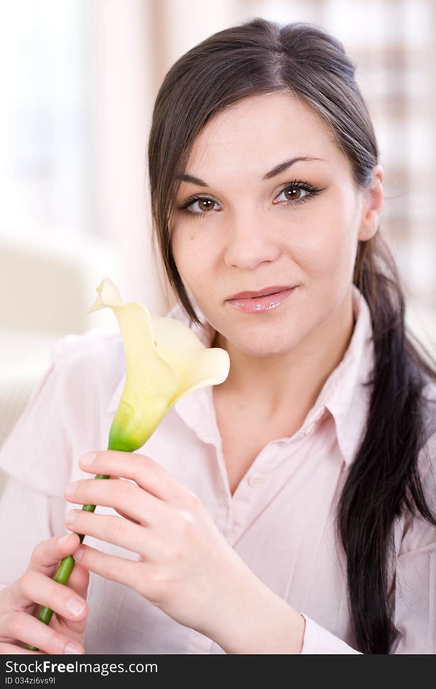 Young adult woman with flower at home. Young adult woman with flower at home