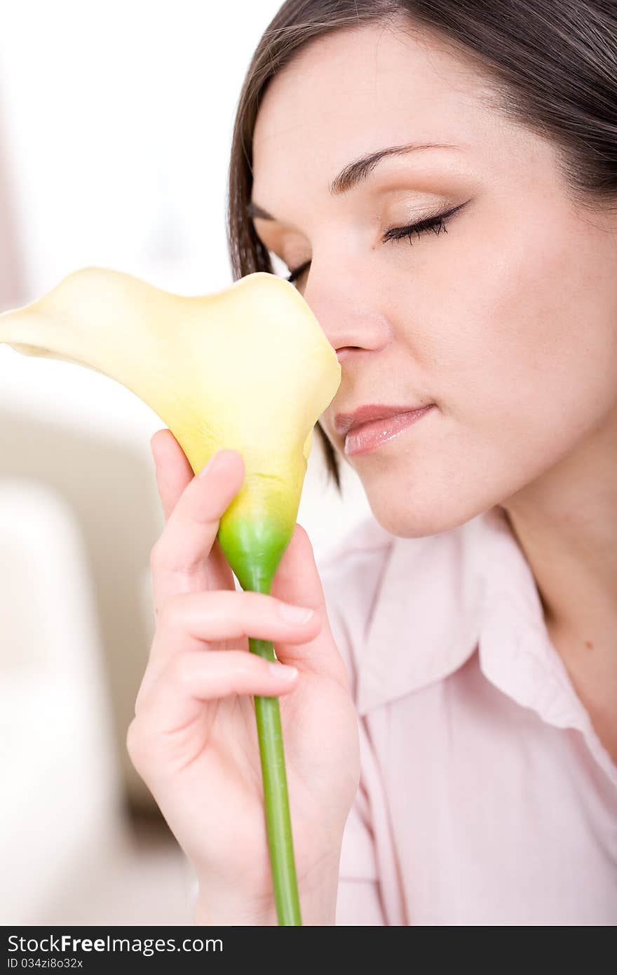 Young adult woman with flower at home. Young adult woman with flower at home