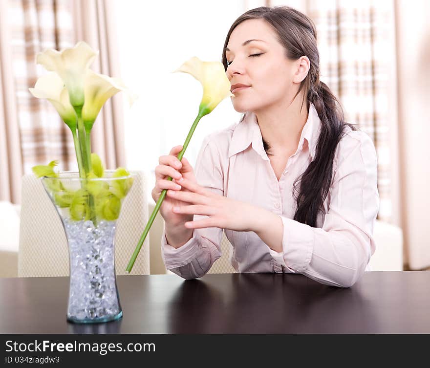 Young adult woman with flower at home. Young adult woman with flower at home