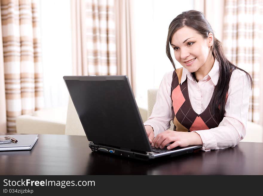 Young adult businesswoman at home