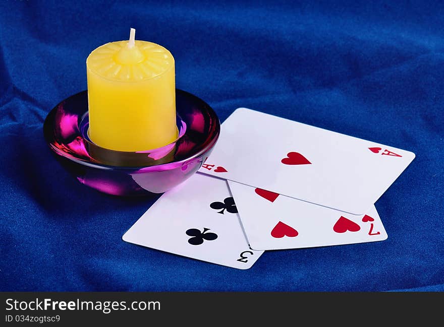 Three Playing Cards And Candle