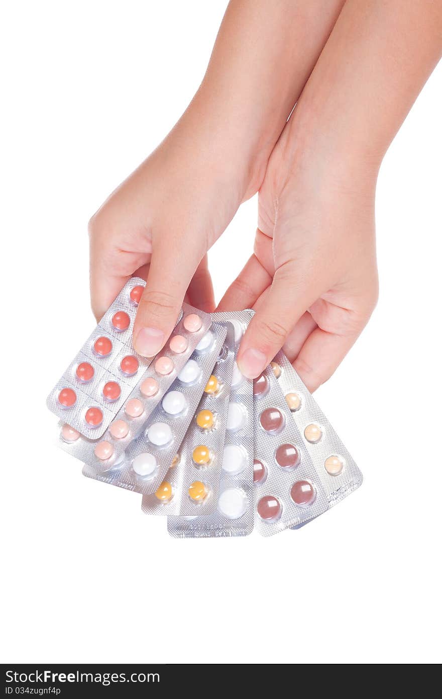 Medical pills on a female hand, isolated