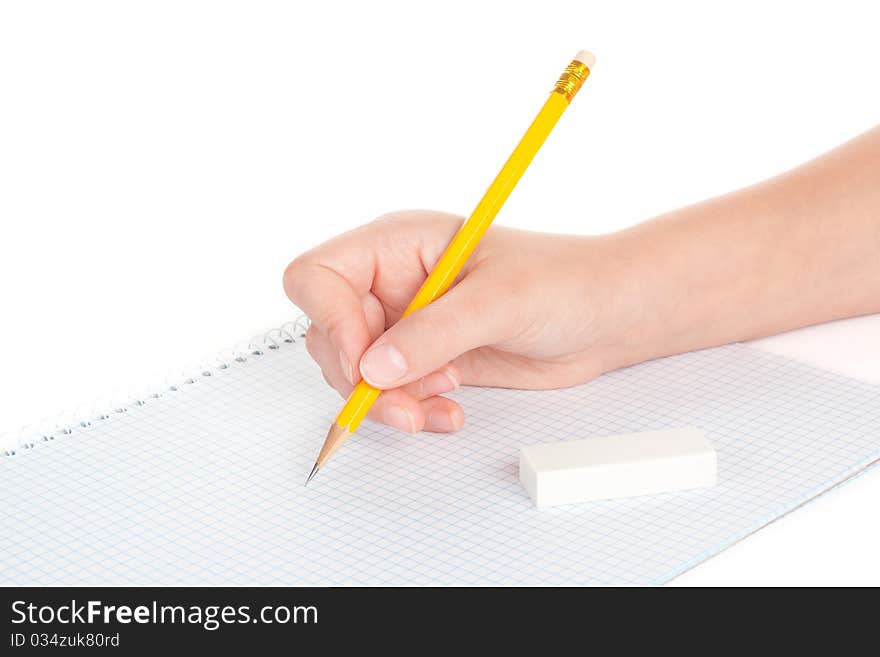 Women hand with pencil and a notebook, isolated