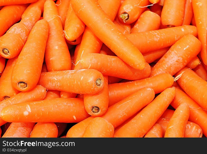 Arrangement of Carrots At A Market Stall Forming A Background