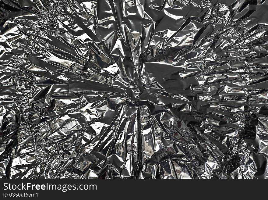 Close-up image of silver, crinkled metal foil. Close-up image of silver, crinkled metal foil