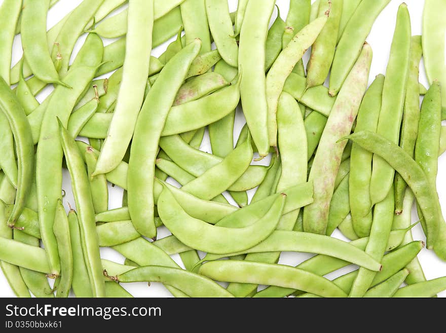 Green beans in the form of a white background