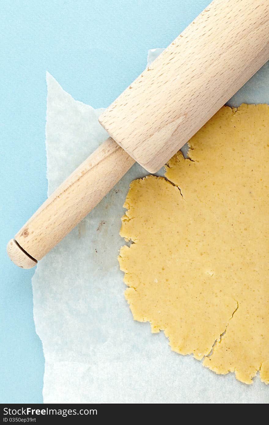 Close up of dough with rolling pin, cookies