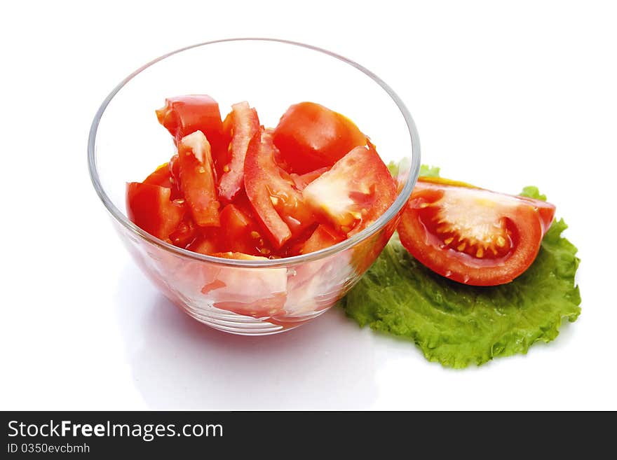 Red Tomato  Sliced Into Pieces  In A Glass Bowl