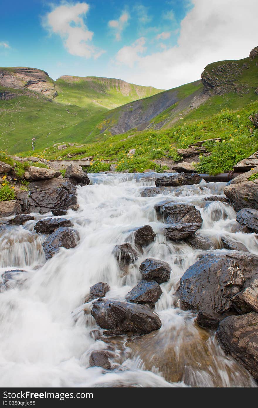 Waterfall in green alps mountains, near Grindelwald. Waterfall in green alps mountains, near Grindelwald