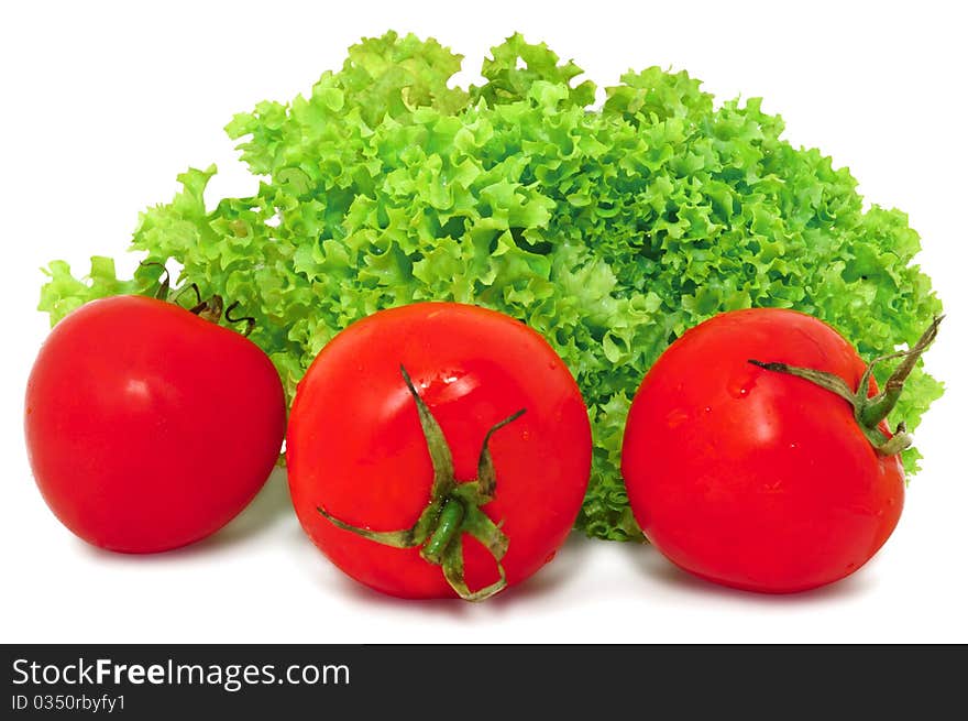 Red tomatoes and green lettuce, isolated on white