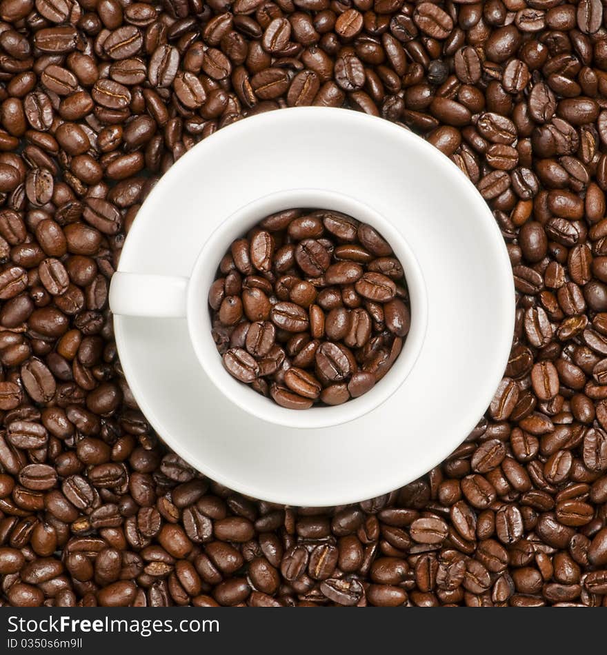 White coffee cup with plate and coffee beans. White coffee cup with plate and coffee beans.