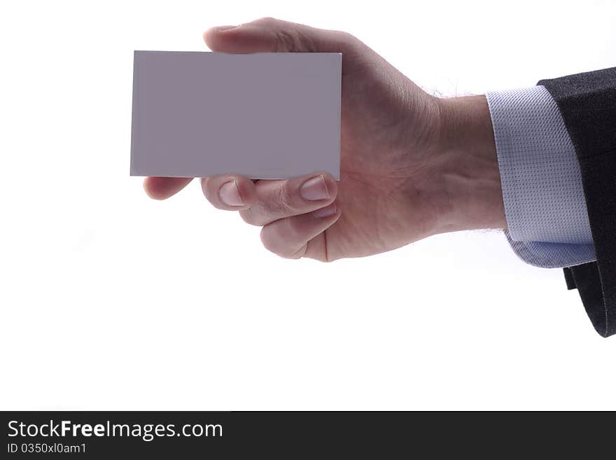 Businessman in grey suit and a blue shirt shows professional business card with copy space, shallow dept of field. Businessman in grey suit and a blue shirt shows professional business card with copy space, shallow dept of field