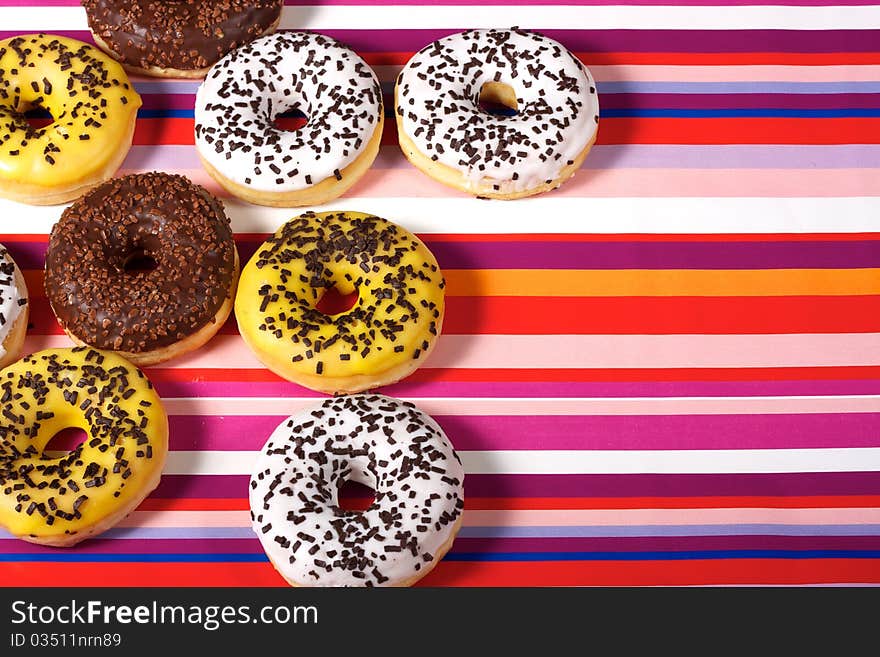 Sweet Donuts on red tablecloth