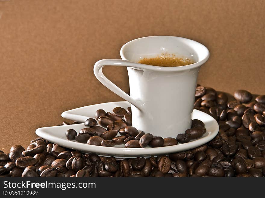 A creamy espresso with a coffee bean