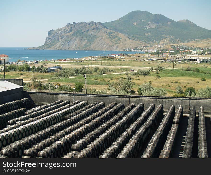 Wine barrels are located in a number of mountains in the background