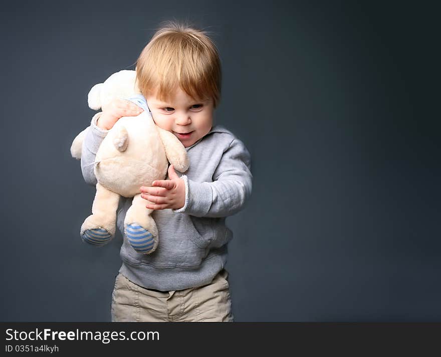 Baby hugging teddybear