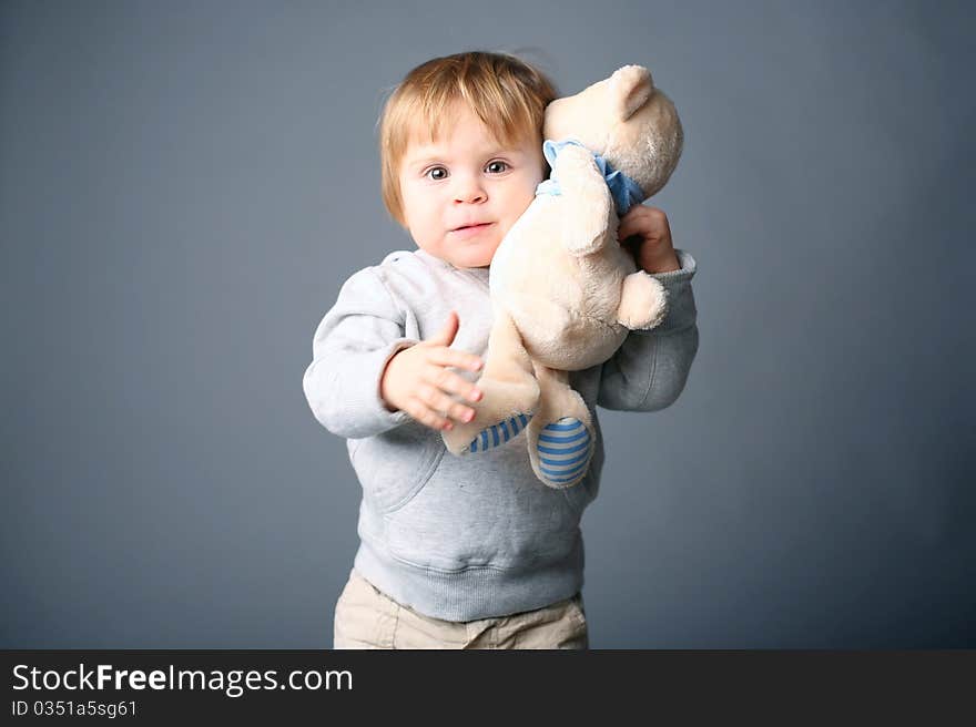 Baby hugging teddybear