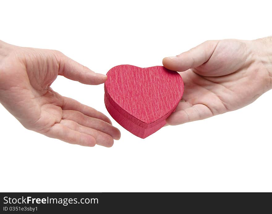 The hand holds a gift box isolated on white. The hand holds a gift box isolated on white