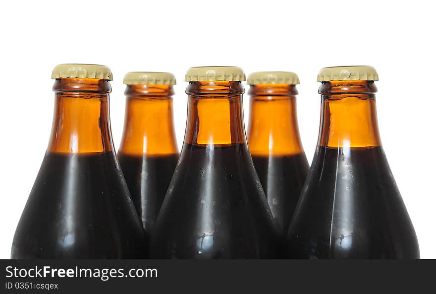 Dark beer bottles isolated on white background