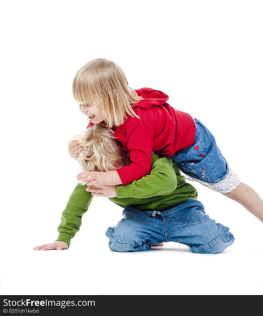 Two young siblings fooling around with each other - isolated on white. Two young siblings fooling around with each other - isolated on white